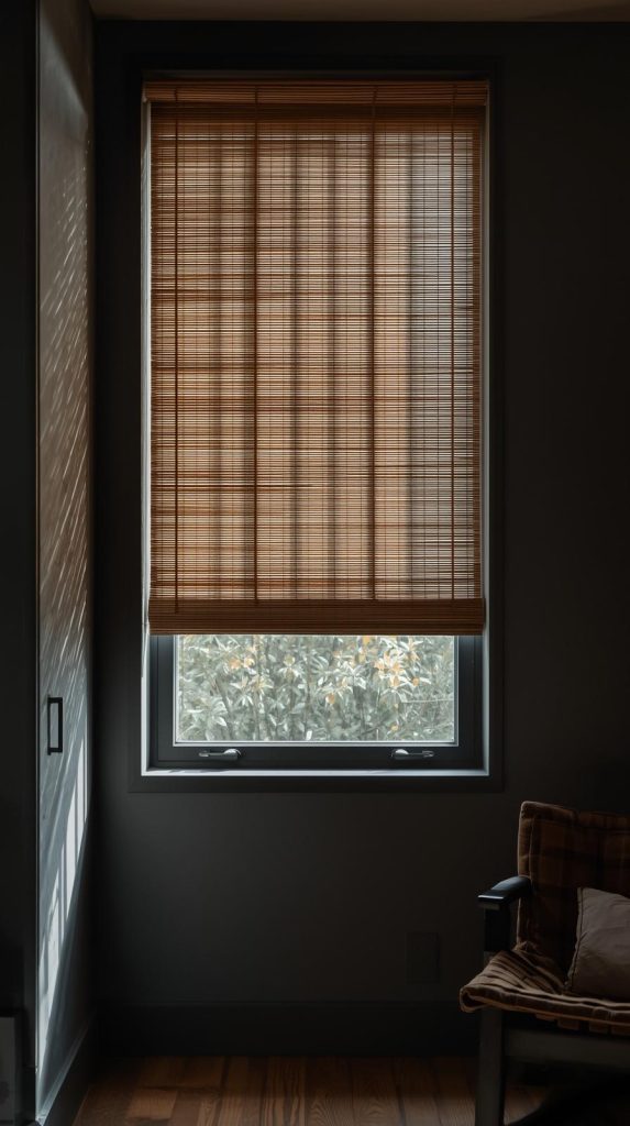 20 Dark Home Decor Ideas with Natural Materials for a Cozy & Stylish Home 13 Bamboo Blinds & Dark Walls