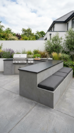 18 Easy Outdoor Kitchen DIY Ideas Modern L-Shape Build 11 11. L-Shape With Integrated Concrete Block Bench Seating Along the Bar Arm