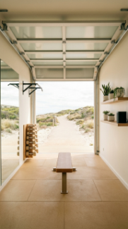 18 Coastal Home Gym Inspiration Garage Conversion Ideas 13 13. Coastal Garage Gym With Glass Garage Door and Natural Light