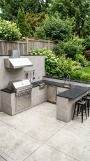 18 Easy Outdoor Kitchen DIY Ideas Modern L-Shape Build 13 13. L-Shape With Integrated Fridge, Sink, and Grill — Full Zone Build