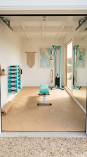 18 Coastal Home Gym Inspiration Garage Conversion Ideas 2 2. Sandy Hex Tile Floor Coastal Gym With Turquoise Equipment