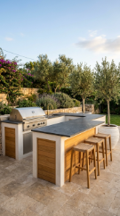 18 Easy Outdoor Kitchen DIY Ideas Modern L-Shape Build 4 4. Cinder Block L-Shape With White Limewash Stucco and Teak Wood Accents