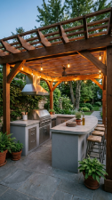 18 Easy Outdoor Kitchen DIY Ideas Modern L-Shape Build 6 6. L-Shape Build Under a DIY Pergola With String Lights