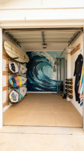 18 Coastal Home Gym Inspiration Garage Conversion Ideas 6 6. Surf Inspired Garage Gym With Board Storage and Wave Art
