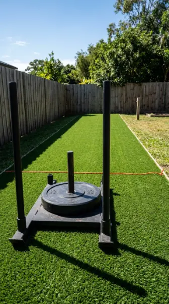 14 Budget-Friendly Home Gym Designs Outdoor Backyard Turf 5 5. Create a Dedicated Sled Push Lane Down the Turf Length