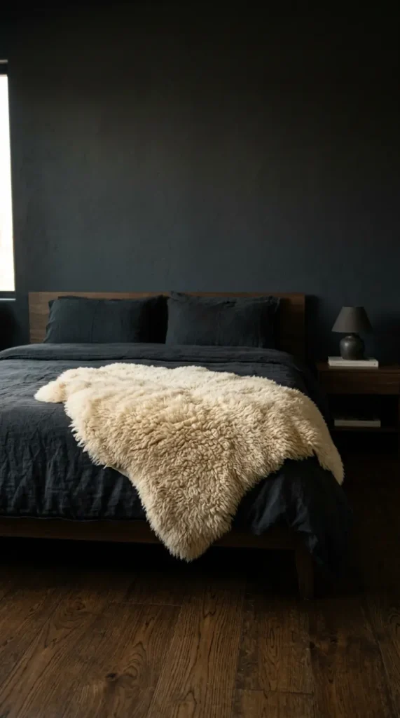 13 Minimalist Luxury Bedroom Dark Moody Charcoal Dramatic Calm 12 12. Charcoal Bedroom With a Fur or Shearling Throw as the Only Softness