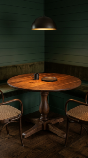 13 DIY Breakfast Nook Dark Green Shiplap Moody Corner 4 4. Choose a Round Dark Walnut Pedestal Table as the Nook Centerpiece