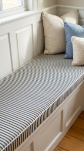 14 DIY Breakfast Nook Farmhouse Wainscoting Storage Bench 4 4. Cover the Bench Cushion in Classic Ticking Stripe Fabric