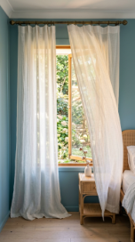 17 Bedroom Aesthetic Coastal Grandmother Sea Glass Blue 4 4. Sheer White Linen Curtains That Move in the Breeze