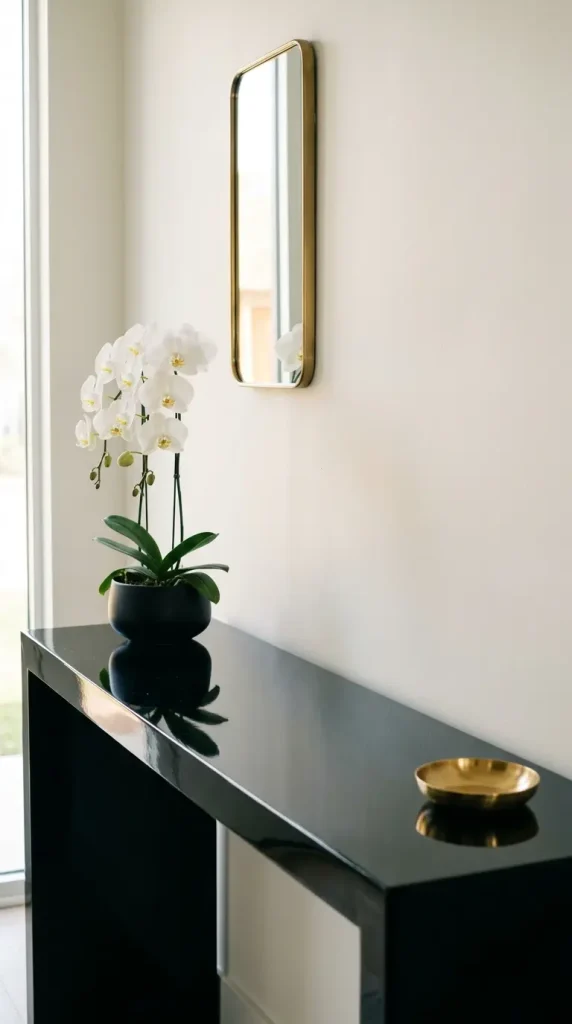 17 Flower Aesthetic Home Decor Entryway Console Quiet Luxury 5 5. Black Lacquer Console With a White Orchid and Brass Catchall