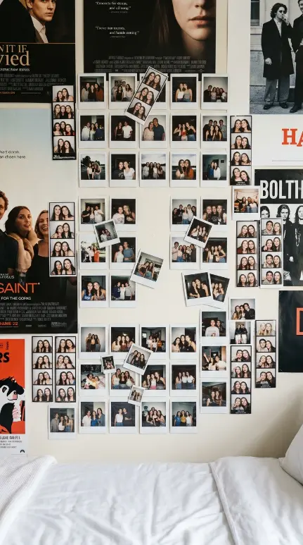 26 Dorm Bed Inspo Maximalist Gallery Wall Twin XL Style 5 5. The Polaroid and Photo Strip Memory Cluster — Personal Documentary Layer