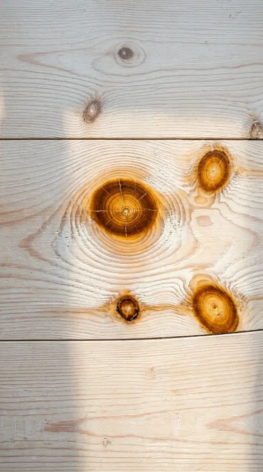 27 Light Wood Flooring for Farmhouse Whitewashed Pine Style 5 5. Whitewashed Pine with Pine Knot as Design Feature