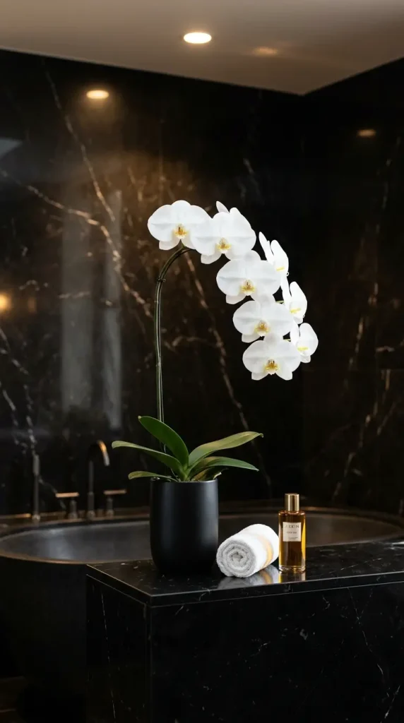 23 Bathroom Plants Decor Luxury Spa Black Marble Style 6 6. Orchid in a Black Matte Ceramic Vessel on the Bath Surround