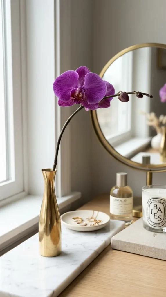 17 Jewel Tone Vanity Styling Ideas With Rich Color 6 6. Amethyst Purple Orchid in a Brass Bud Vase