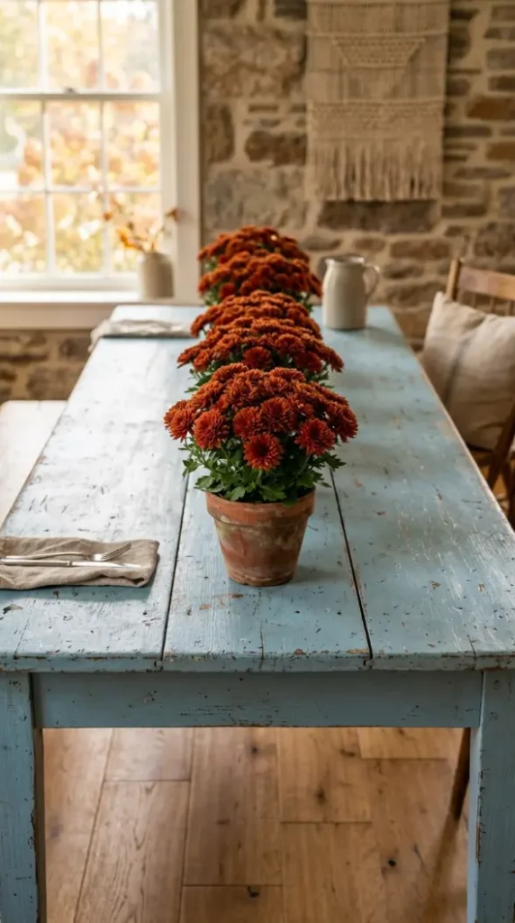 13 Blue and Orange Thanksgiving Table Ideas to Save 7 7. Modern Farmhouse Powder Blue Paint and Potted Rust Mums