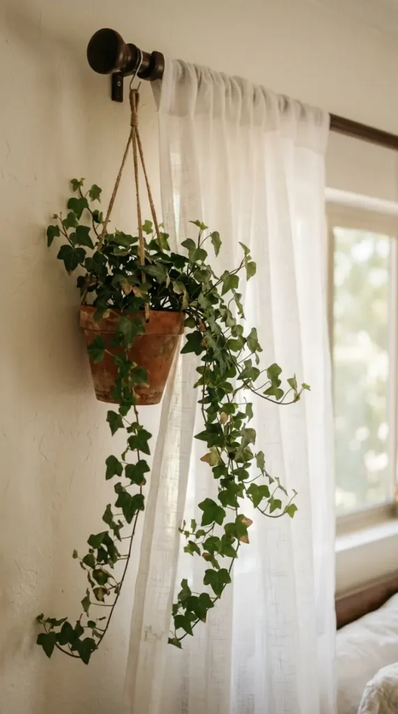 18 Romanticizing My Room Small Space Sheer Drapery Ideas 8 8. Trailing Ivy Hung Near the Curtain Rod